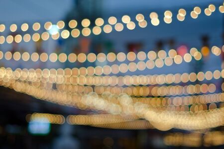 Bokeh background for artwork (Night view of light bulb)の写真素材