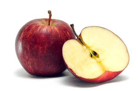 Apple close-up view isolated on white background (Other names are Malus, domestica, golden apple, crab apple, red apple)の写真素材