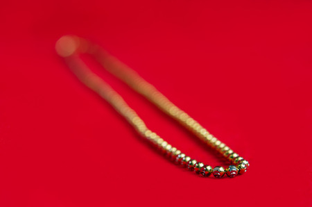 Gold necklace 750k gold grade with Italy design isolated on red flannel cloth background