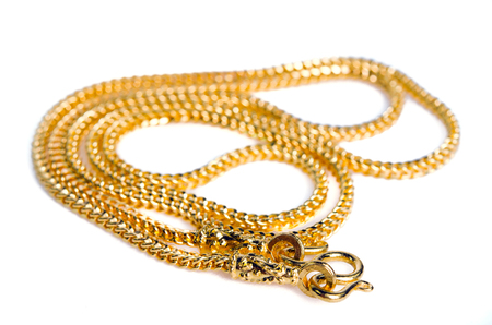 Gold necklace 96.5 precent Thai gold grade with gold hook isolated on white background with blank copy text spaceの写真素材