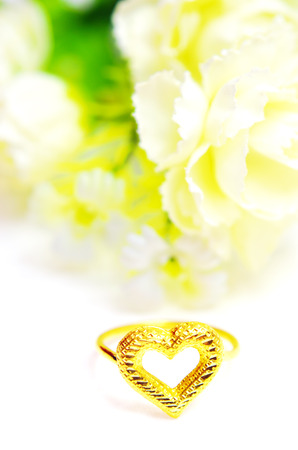 Gold pendant cameo fancy ring jewellery in heart shape with special Thai gold design and flowers isolated on white backgroundの写真素材