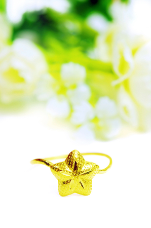 Gold pendant cameo fancy ring jewellery with special Thai gold design heart shape and flowers isolated on white backgroundの写真素材