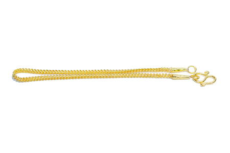 Gold pendant bracelet with special Thai gold design isolated on white backgroundの写真素材
