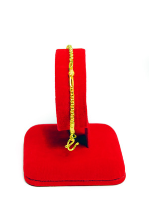 Gold pendant bracelet with special Thai gold design isolated on white backgroundの写真素材
