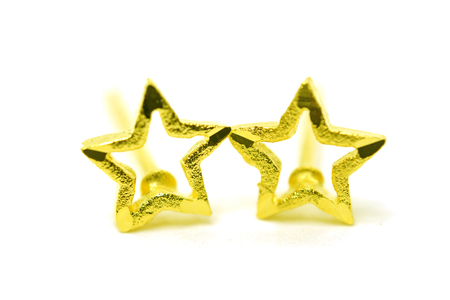 Gold pendant cameo earring jewellery with special Thai gold design star shape isolated on white...