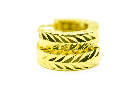 Gold pendant cameo earring jewellery with special Thai gold design isolated on white backgroundの写真素材