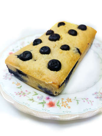 Blueberry bread on the beautiful flower dish isolated on white background