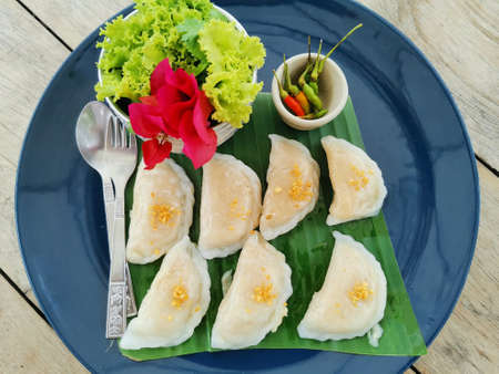 pork dumplings served with fresh vegetables