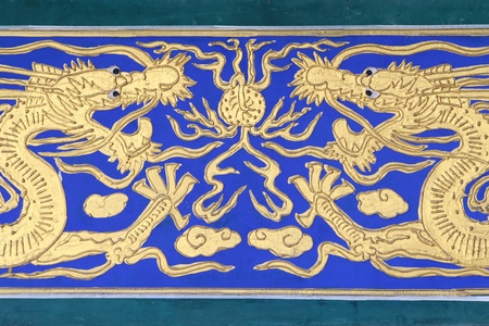 Golden Chinese Dragon on Blue Backgroundの写真素材