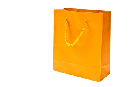 Orange paper bag isolated on white backgroundの写真素材