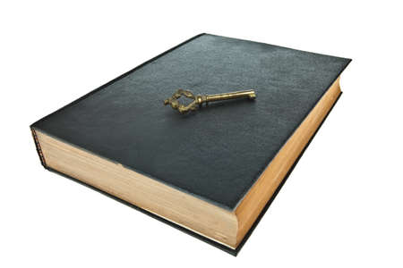 Old book with key isolated on white backgroundの写真素材