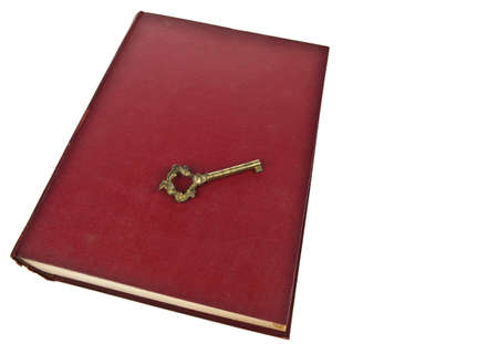 Old book with key isolated on white backgroundの写真素材