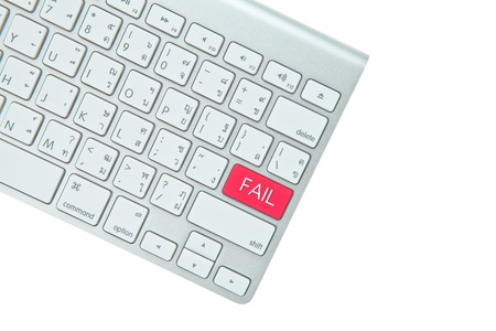 Red fail button on computer keyboard isolated on white backgroundの写真素材