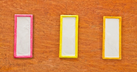 Colorful photo frame on wood wallの写真素材