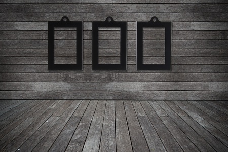 Grunge old wood texture room background with photo frame