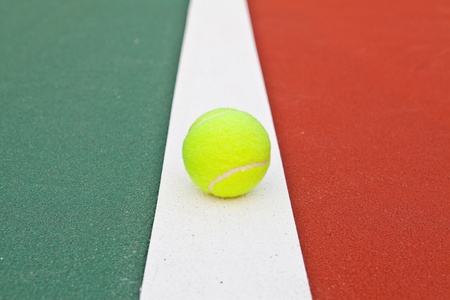 Tennis court at base line with ballの写真素材