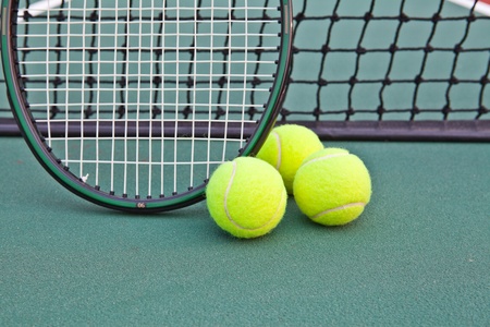 Tennis court with ball and racket