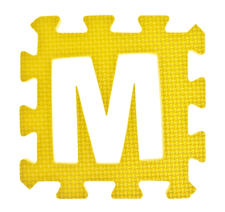 Alphabet toy piece isolated on white backgroundの写真素材