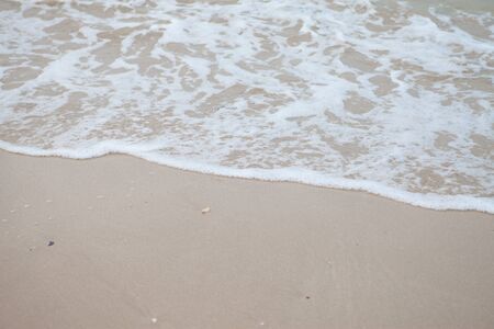 wave on sand beachの写真素材