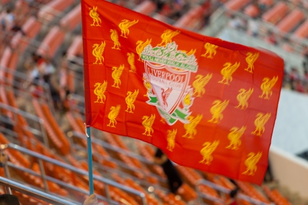 BANGKOK - JULY 28   Liverpool fan wave the flag while in the stadium during match between Thai National team and Liverpool FC in LFC Tour 2013 tournament in Bangkok, Thailand during 25-28 July 2013のeditorial素材