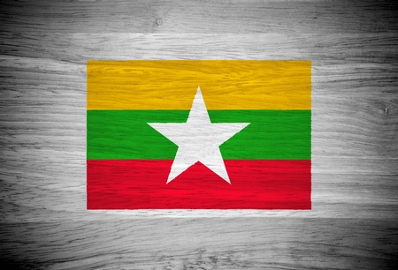 Myanmar flag on wood textureの写真素材