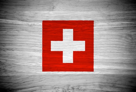 Switzerland flag on wood textureの写真素材