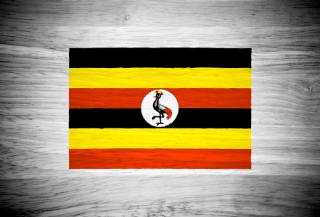 Uganda flag on wood textureの写真素材
