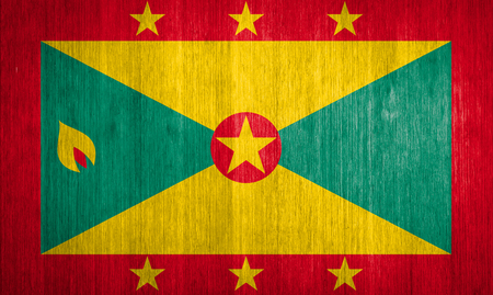 Grenada Flag on wood background