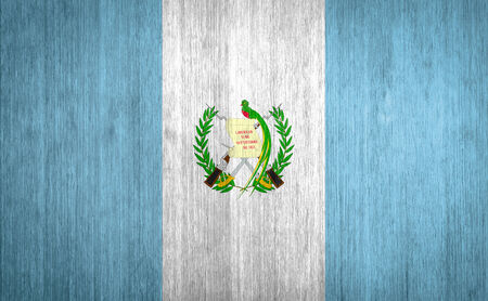 Guatemala Flag on wood backgroundの写真素材