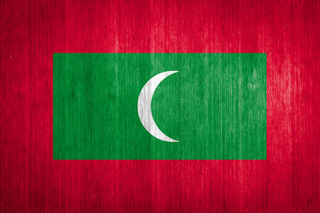 Maldives Flag on wood backgroundの写真素材