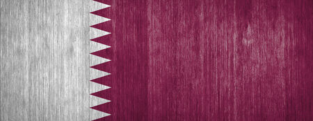 Qatar Flag on wood backgroundの写真素材