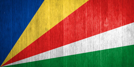 Seychelles Flag on wood backgroundの写真素材