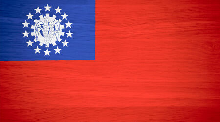 Myanmar flag on wood textureの写真素材
