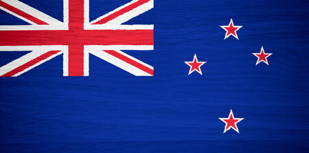 New Zealand flag on wood textureの写真素材
