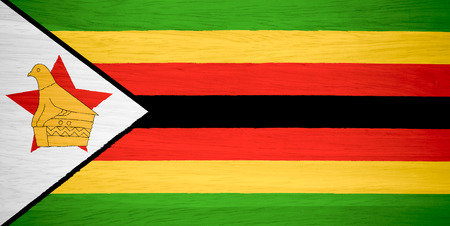 Zimbabwe flag on wood textureの写真素材