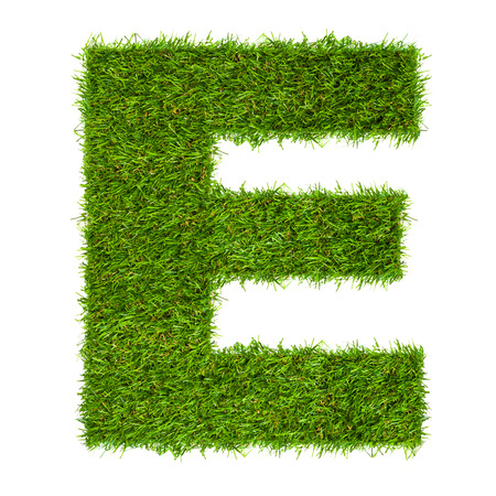 Letter E made of green grass isolated on whiteの写真素材