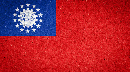 Myanmar flag on paper backgroundの写真素材