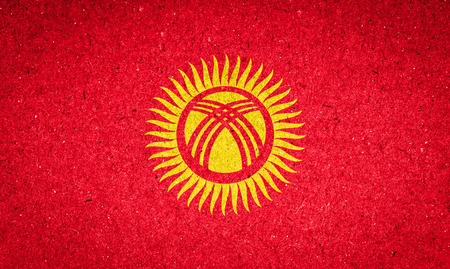 Kyrgyzstan flag on paper backgroundの写真素材
