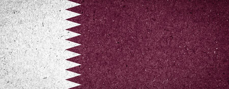 Qatar flag on paper backgroundの写真素材