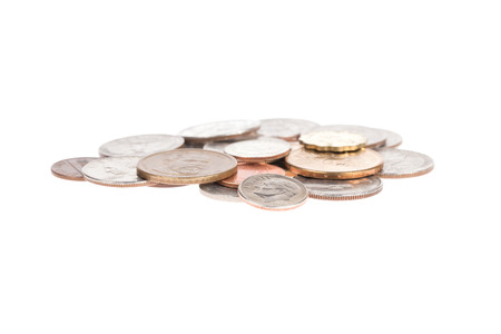 Pile of US coins isolated on white backgroundの写真素材