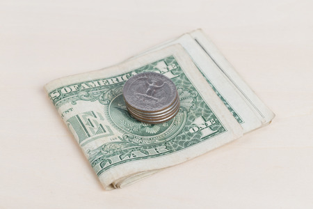used US banknotes on wood table close up
