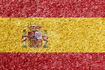 Spain flag on grass background textureの写真素材