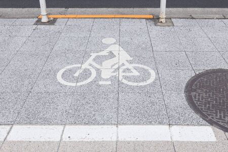 zebra crossing and bicycle sign on the street in japanの写真素材