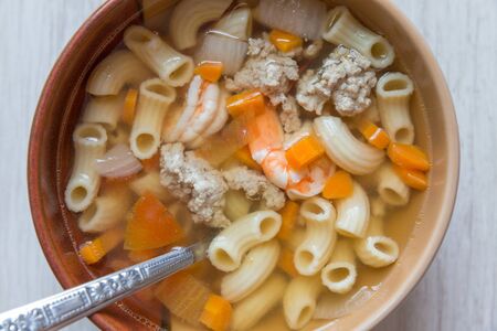 Asian macaroni soup with shrimp and chop porkの写真素材