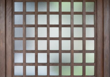 Vintage brown wooden windows in chinese or japanese style with reflect glassの写真素材