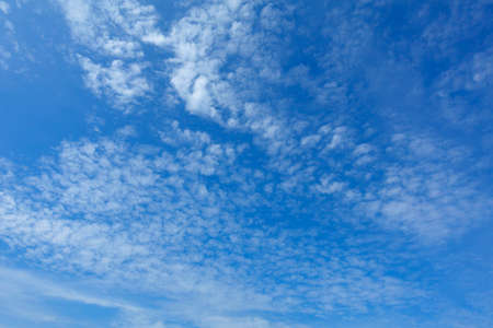 Blue sky with scattered cloud