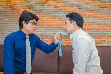Businessman fighting in office coffee shop