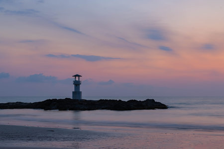Long exposure shot of lighthouse on Khao Lak beach, Krabi, during the sunset, a popular destination in southern of Thailandの写真素材