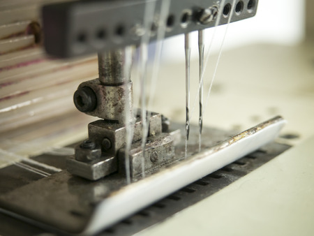 double needles on sewing machine in textile factory.