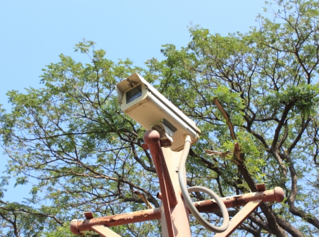 White CCTV camera watching for security 24 hoursの写真素材
